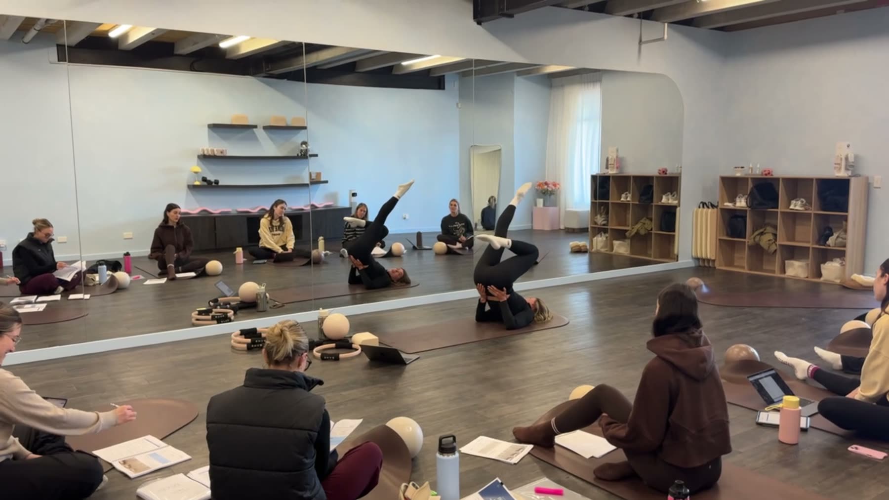 Students practising Mat Pilates on a Body Form Education practical day