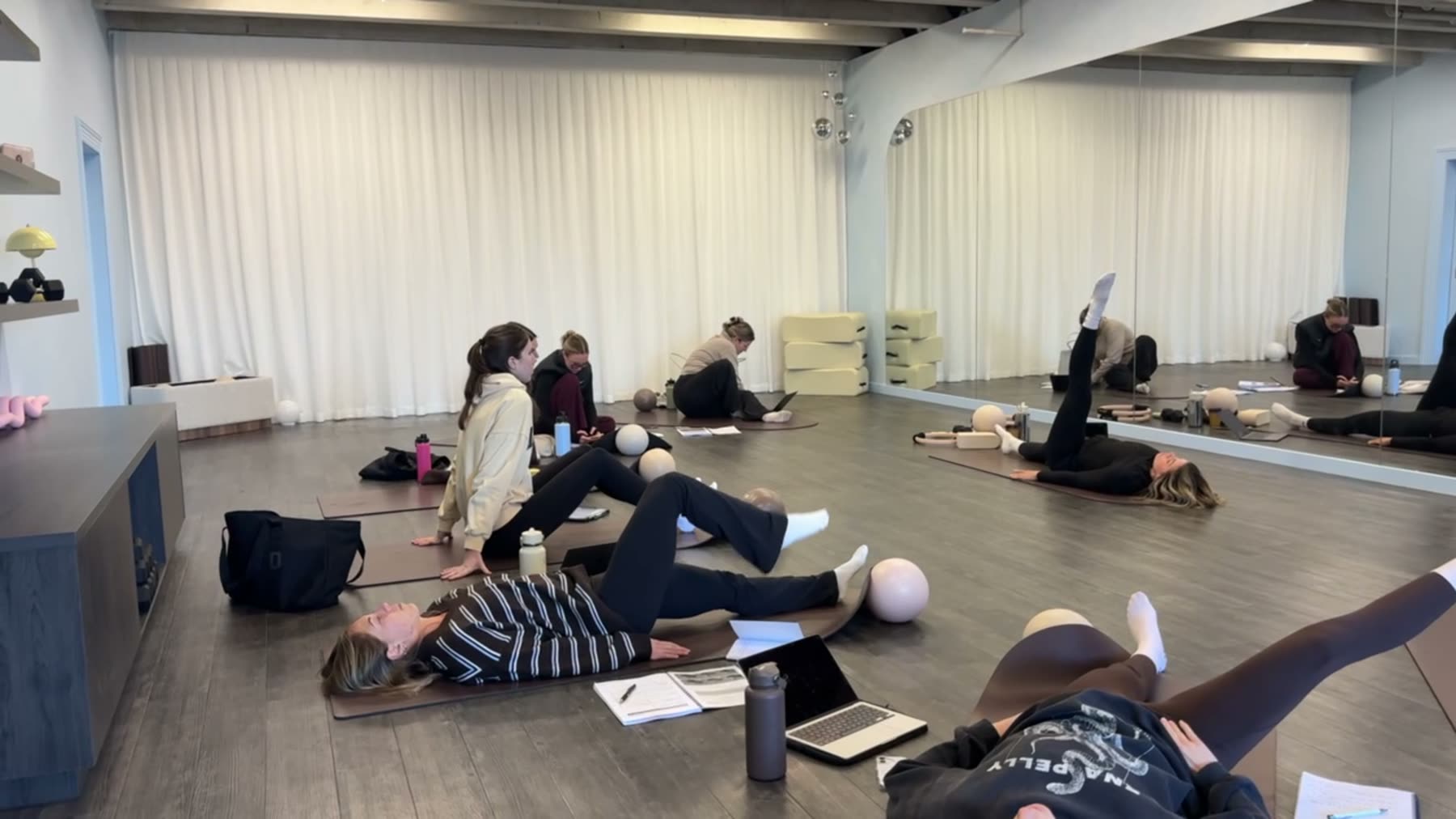 Students practising Mat Pilates on a Body Form Education practical day