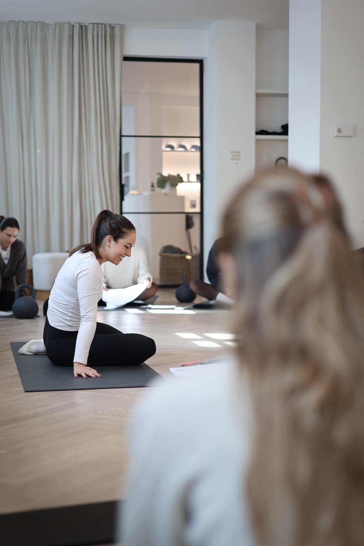 Students practising Mat Pilates on a Body Form Education practical day
