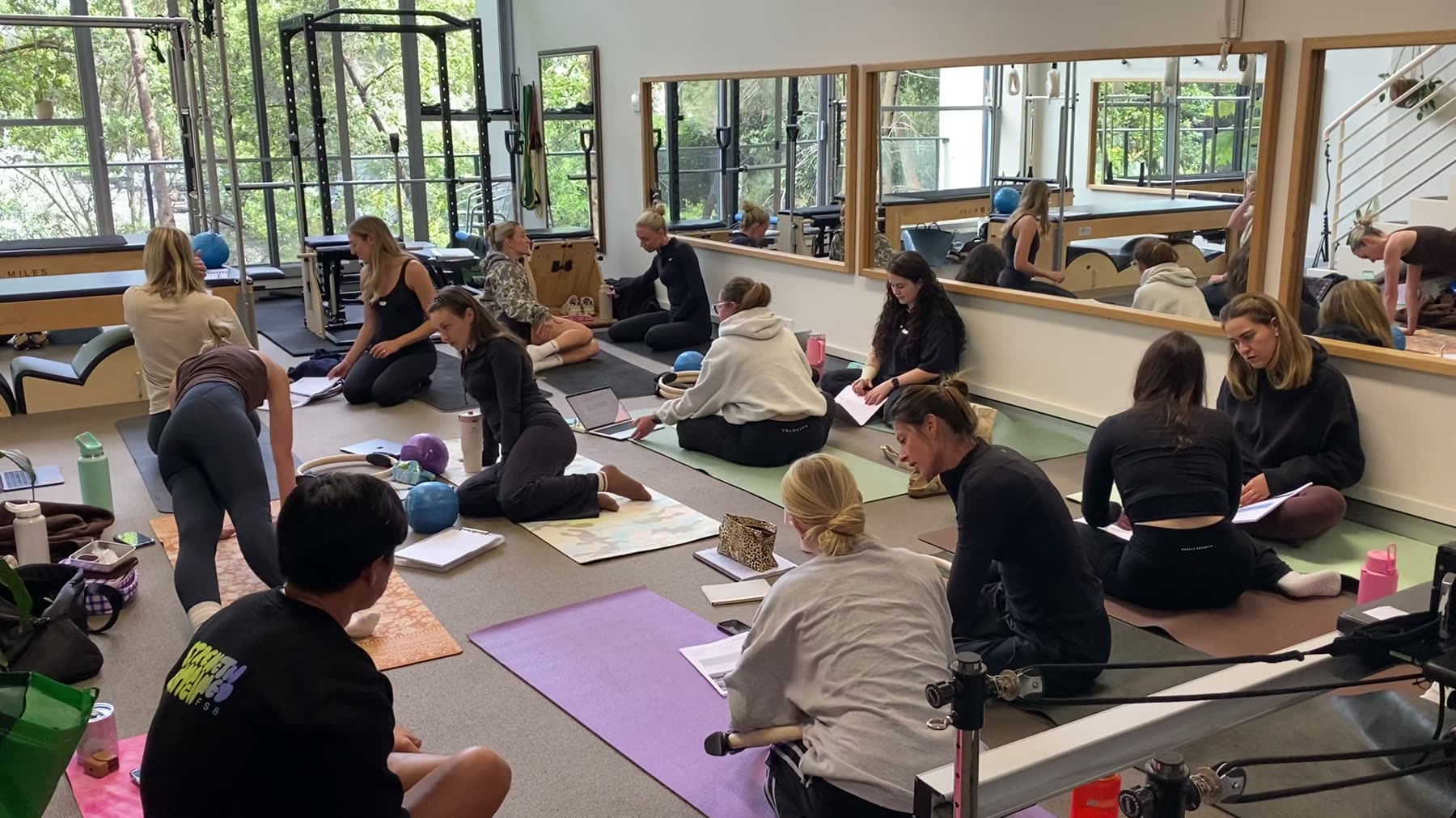 Students practising Mat Pilates on a Body Form Education practical day