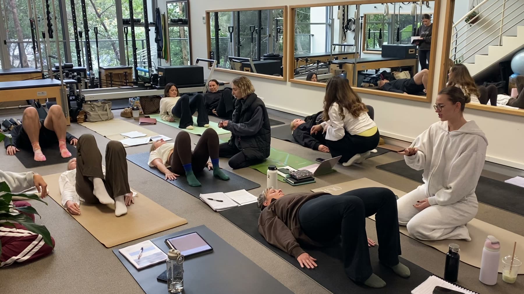 Students practising Mat Pilates on a Body Form Education practical day