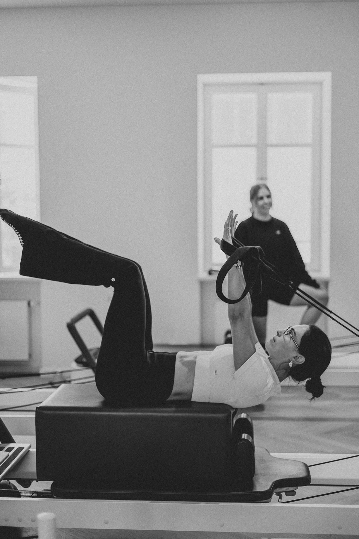 Students and trainer working on Reformers during a Body Form Education intake