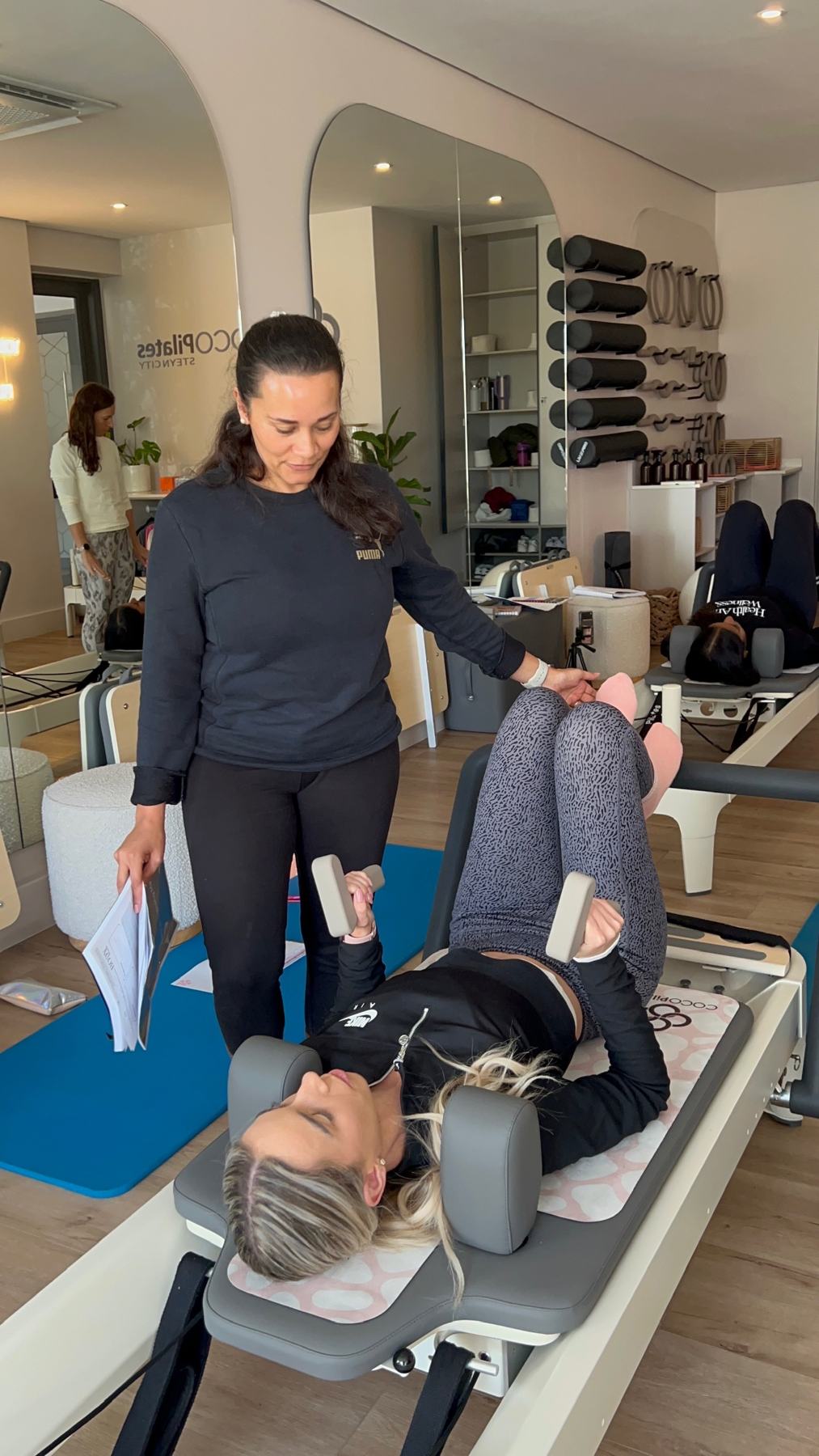 Students and trainer working on Reformers during a Body Form Education intake