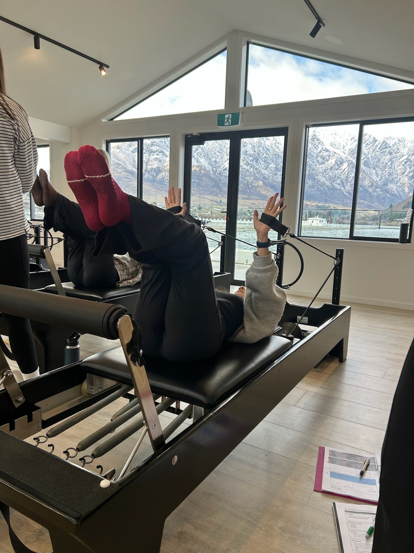 Students and trainer working on Reformers during a Body Form Education intake