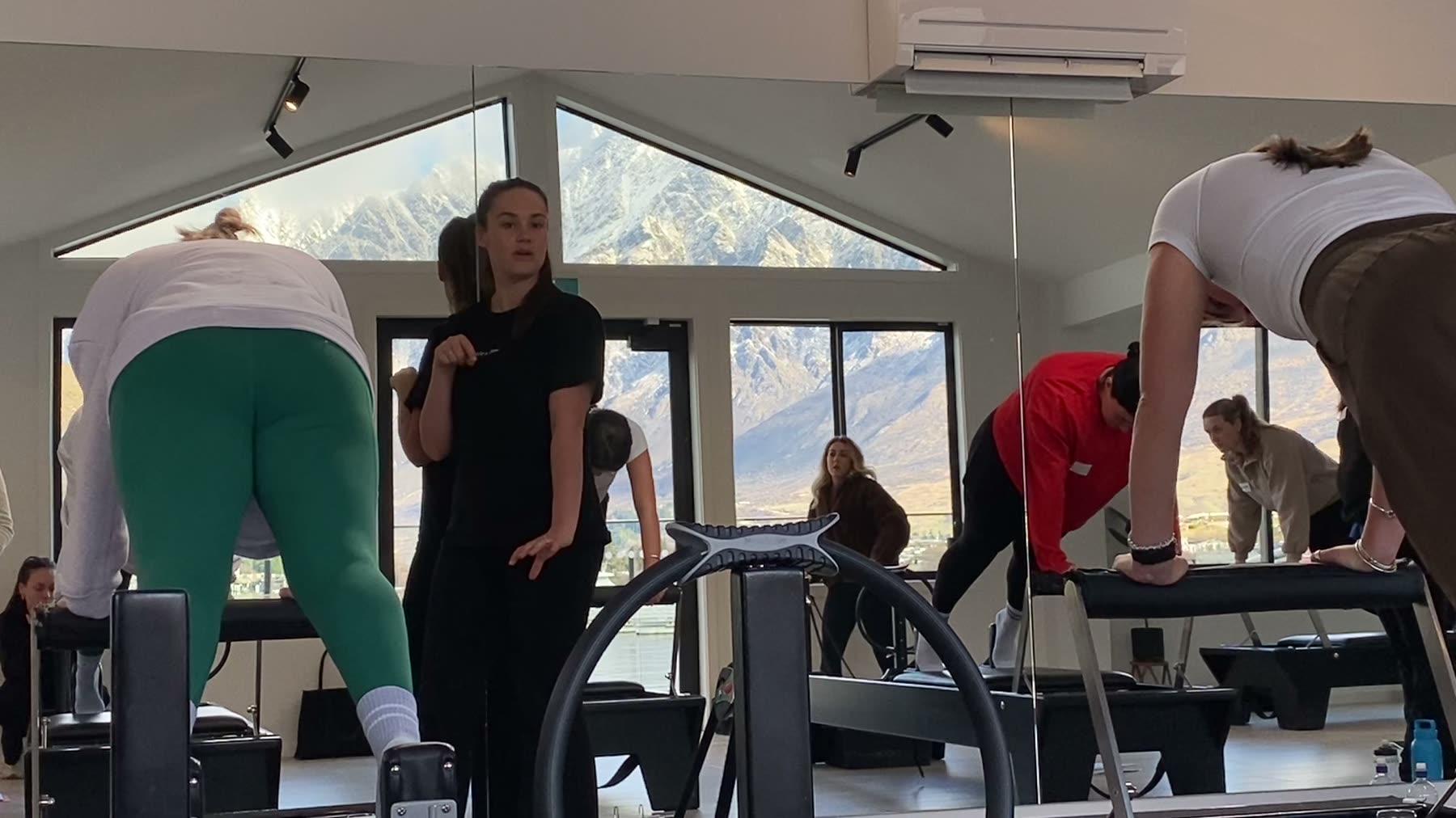Students and trainer working on Reformers during a Body Form Education intake