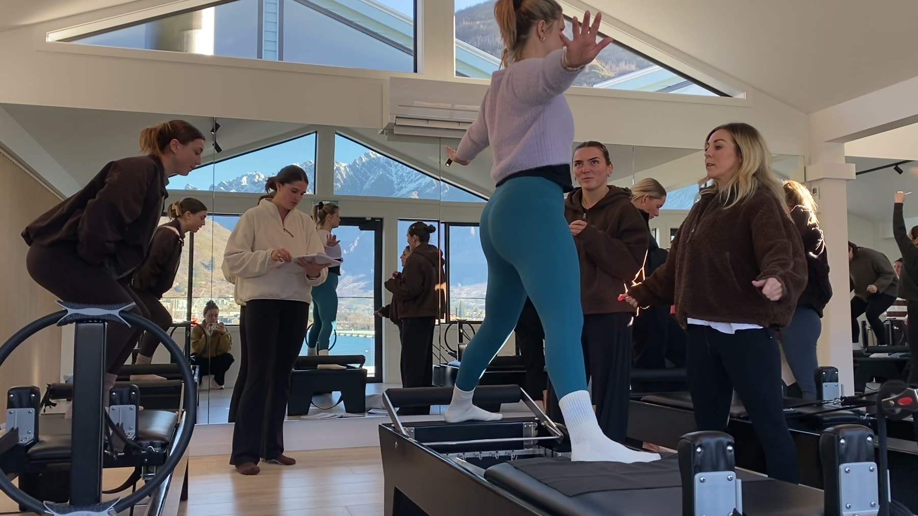 Students and trainer working on Reformers during a Body Form Education intake